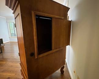 R25 - $60. Entertainment Armoire in Excellent Condition. Has outlets inside. Measures 46" x 26" x 67" tall.