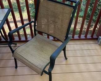 R4 - $225. Garden Treasures Classic Patio Set. Excellent Condition. Table with 4 arm chairs. Metal base with removable tile top. Has been used on a covered screened in porch. Table measures 63" x 39" x 28" tall.