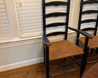 R39 - $150. Shaker style ladderback chairs. Distressed black. 3 side chairs 1 arm chair. All are very sturdy - backs show rubbing wear from sitting/table. Measures 17" wide x 13.75" deep x 42" tall. Floor to seat is 17.5".