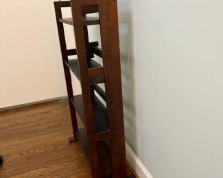 R24 - $25. Folding Bookshelf. In good condition. Measures 22" x 18" x 38" tall.