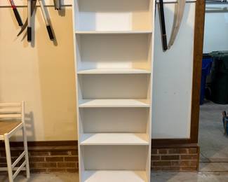 R44 - $20. White finished 5 shelf bookcase. Measures 25" wide x 9.5" deep x 71.5" tall. Shelves are adjustable. Has been in a garage.