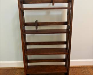 R24 - $25. Folding Bookshelf. In good condition. Measures 22" x 18" x 38" tall.