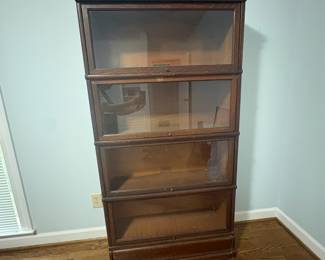 R29 - $500. Globe-Wernicke 4 Stack Barrister Bookcase. Bottom panel has a crack in the glass. Measures 34" wide x 11" deep x 67" tall.
