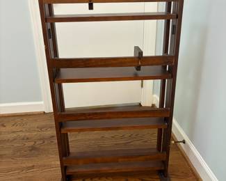 R24 - $25. Folding Bookshelf. In good condition. Measures 22" x 18" x 38" tall.