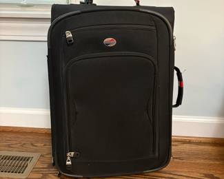 R14 - $10. American Tourister Carry On. Measures 14" x 9" x 22". 2 wheels - not spinners. In good used condition.