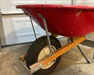 R49 - $40. Red Metal Wheelbarrow. Great condition.