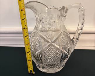R54 - $15. Cut glass pitcher.