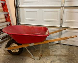 R49 - $40. Red Metal Wheelbarrow. Great condition.