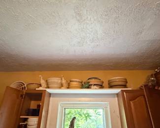 Stoneware Crock Collection with Decorative Figures
