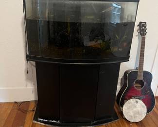 Large fish tank and a nice guitar
