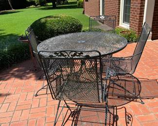 #014 Iron patio table w 4 bouncy chairs 48" round x 29" tall $175.00