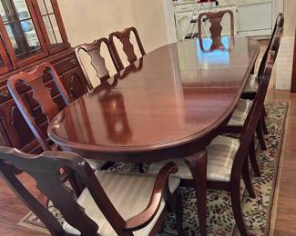 #006 Dining room table. Broyhill. 62-92x42x29" w 8 chairs w upholstered seat w plastic protective cover $275.00