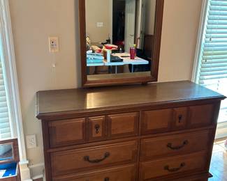 #025 Bassett dresser w mirror. 6 drawers 56x19x32" Mirror 28x39" As is finish $125.00