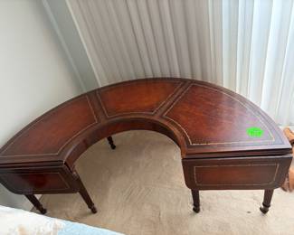 Mahogany half round leather top coffee table