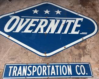 Original Overnite Transportation trailer sign. Overnite sign measures over 6ft and transportation sign measure over 4ft. Signs removed from company equipment when Overnite was acquired by UPS. Belonged to estate owner's father, a longtime Overnite driver.