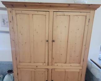 Large cabinet holds a bar