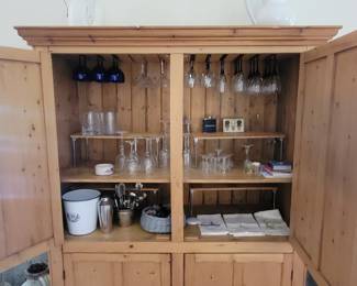 Large cabinet holds a bar