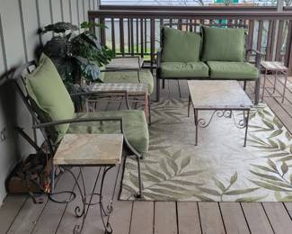 Nice iron outdoor furniture.  Tables have marble tops