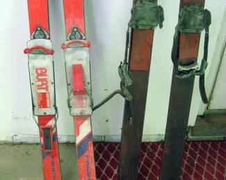 Antique Hickory snow skis with vintage bear trap leather binding.
