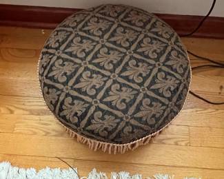 Round Upholstered Ottoman with Fringe