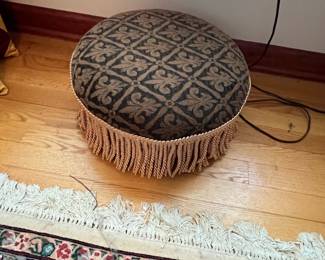 Round Upholstered Ottoman with Fringe