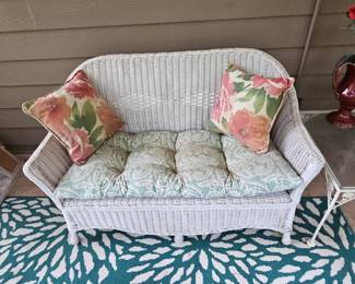 White Wicker Loveseat with Floral Cushions