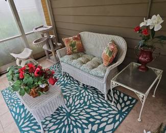White Wicker Loveseat with Floral Cushions