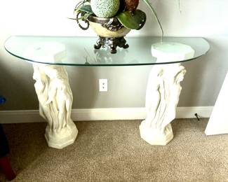 Neoclassical cast stone figural pedestal base with glass top