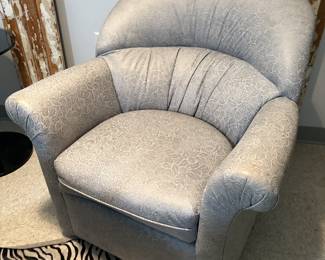 Pair leather floral swivel club chair
