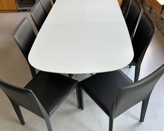 Ten - leather dining chairs (one oversized) $1,500