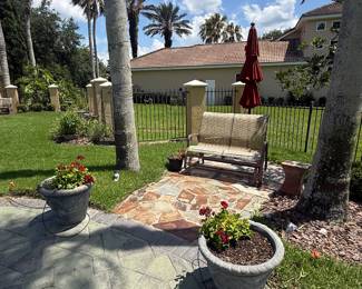 Glider w/cushions, potted plants