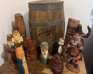 Schlitz storage barrel and many hand carved wooden figures 