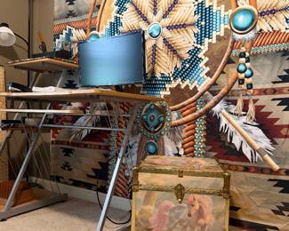 Beautiful Native American Backdrop/bed cover. A very versatile, lightweight desk with  brand new 22" ONN monitor  and other office supplies. Vintage unicorn wooden cube chest with metal trim. 