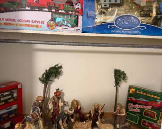 Large Nativity Scene and four train sets: Rudolph the Red Nose Reindeer, Mickey Mouse 