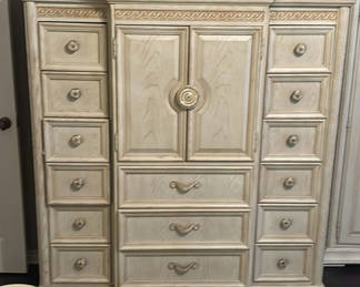 Lot 24: Ornate cream-colored armoire/dresser with multiple drawers