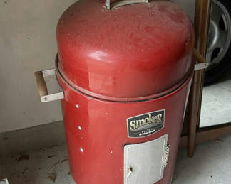 Lot 157: Red barrel-style smoker with wood chunks
