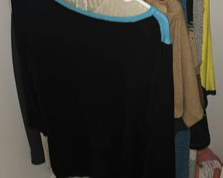 Lot 61: Assorted women's knit sweaters and tops on hangers