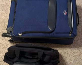 Lot 117: Blue Olympia rolling suitcase with black carry-on bag and iron