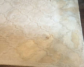 Lot 135: Beige area rug with abstract pattern