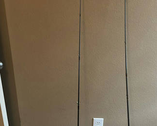 Lot 16: Two fishing rods with reels