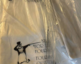 Lot 169: White garment bags with penguin illustration