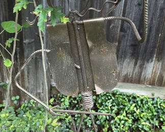 Lot 143: Rusty metal cowboy-hat humanoid garden sculpture with hanging basket