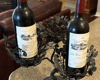 Lot 118: Two wine bottles in a metal leaf candelabra centerpiece