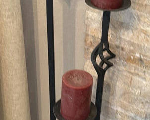 Lot 130: Three Black Metal Candle Holders with Red Pillar Candles