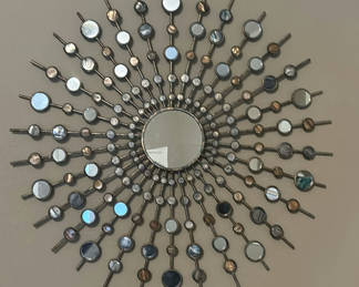 Lot 38: Decorative mirrors, butterfly wall art, and floral basket arrangement