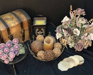 Lot 129: Decorative still life: antique trunk, candles, and dried floral arrangement