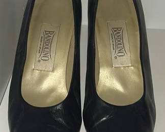 Lot 46: Black Bandolino pumps, pink leopard-patterned flip-flops, and black slingback sandals