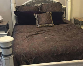 Lot 43: Cream four-poster bed with wrought-iron headboard and circular wall art
