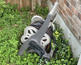 Lot 142: Wheeled garden hose reel with coiled hose