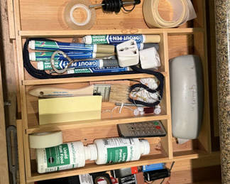 Lot 109: Assorted tools, adhesives, and maintenance supplies in a wooden organizer